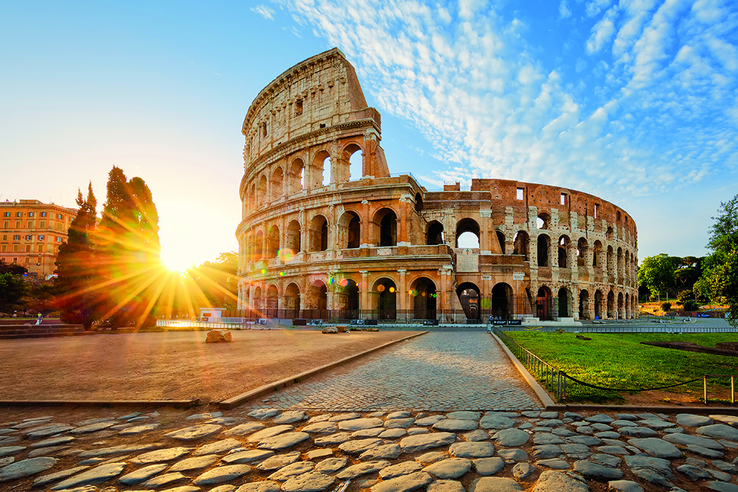 Colosseum in Rome and morning sun, Italy