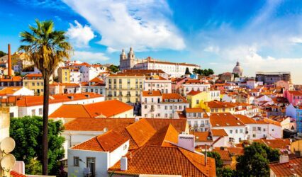 Vibrant rooftops and historic architecture in Lisbon's scenic Alfama district.